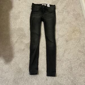 Hollister black super skinny jeans, low rise three button size 1/w 25